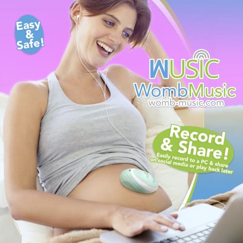 a woman using baby heartbeat monitor while working on a laptop